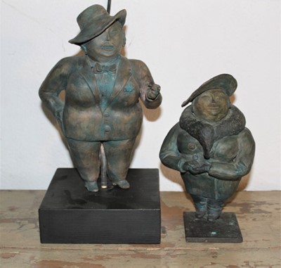 Lot 1650 - English School, second half 20th century, pair of bronzed ceramic figures of buxom women wearing broad rimmed hats, one raided on wooden plinth, the other on metal base, total height 28cm and 20cm