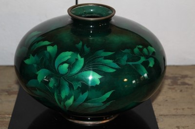 Lot 1653 - Mid 20th century Japanese bulbous cloisonné vase with foliate ornament on green ground, 18cm high, raised on perspex base in original wooden case