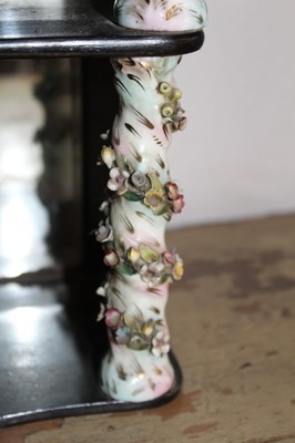 Lot 1656 - Antique wall hanging shelves with mirrored back and mahogany shaped shelves between porcelain floral encrusted spiral turned columns, 24cm wide x 35cm high