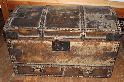 Lot 1675 - 18th century hide and metal stud upholstered dome topped trunk with handed lip, two frieze drawers and carrying handles, 75cm wide