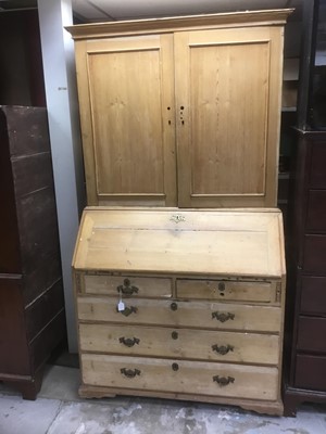 Lot 1690 - George III pine bureau cabinet, with panelled upper section enclosing shelves, sloping fall with fitted interior, two short over three graduated drawers, on bracket feet, 113cm wide x 56cm deep x...