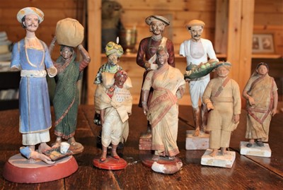 Lot 1698 - Group of approximately ten 19th century Indian painted terracotta figures, together with other carved wooden Indian ceremonial figures