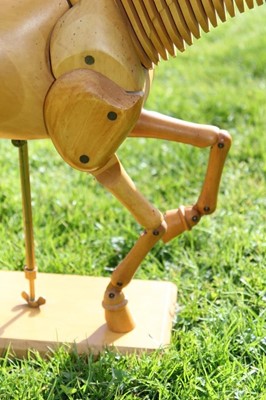 Lot 1700 - Artists articulated wooden model of a horse, on rectangular plinth, 55cm long overall