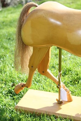 Lot 1700 - Artists articulated wooden model of a horse, on rectangular plinth, 55cm long overall