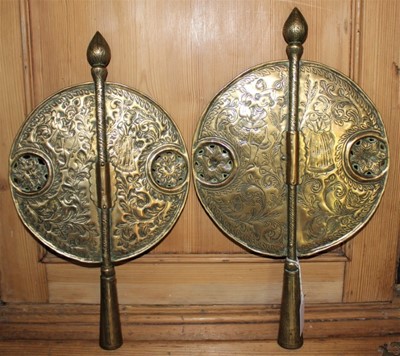 Lot 1707 - Pair of 19th century Indian brass finials with circular tooled and pierced banner, 40cm high