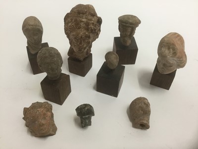 Lot 1737 - Group of nine Greco Roman terracotta sculptural fragments, including five mounted on plinth bases, the largest fragment 5.5cm high