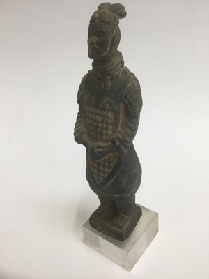 Lot 1739 - Chinese terracotta warrior figure, possibly ancient, standing pose, impressed character marks to base, 17cm high