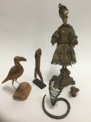 Lot 1745 - Group of sculptural works of art, to include antique possibly 18th century carved wood and wax headed doll, raised on associated wooden triangular plinth, total height 43cm, wire work figure of a c...