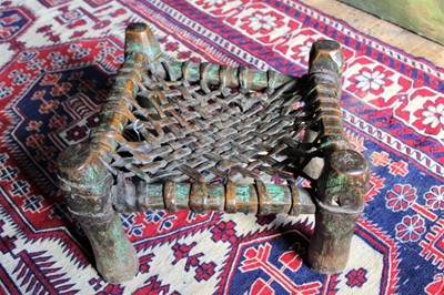 Lot 1748 - Antique North African hardwood and leather woven stool, 40cm wide