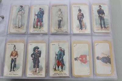 Lot 148 - Cigarette cards - Three blue binders containing a large selection of miscellaneous sets.