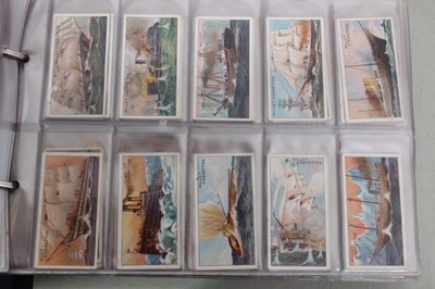 Lot 148 - Cigarette cards - Three blue binders containing a large selection of miscellaneous sets.