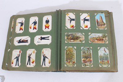 Lot 150 - Cigarette cards - An old slip-in type album containing a large selection of cigarette cards.