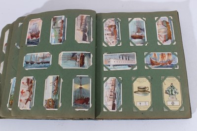 Lot 150 - Cigarette cards - An old slip-in type album containing a large selection of cigarette cards.