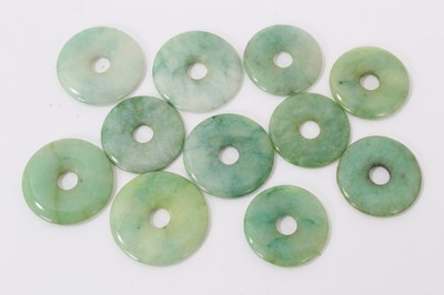 Lot 841 - Eleven Chinese green jade/hardstone bi discs/counters