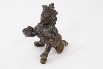 Lot 817 - Antique Indian bronze figure of the baby Krishna with a butter ball