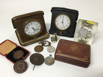 Lot 121 - Two leather cased travelling timepieces, assorted medallions to include Royal Life Saving, Arm Ski Championships, Winter Olympic Games 1952, Falmouth Regatta 1948 and other items