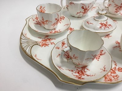 Lot 136 - Two Royal Crown Derby porcelain teasets on trays, one on blue ground, the other on red, 22 pieces