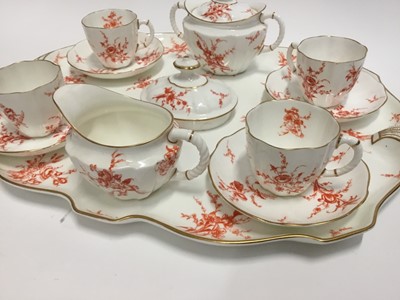 Lot 136 - Two Royal Crown Derby porcelain teasets on trays, one on blue ground, the other on red, 22 pieces