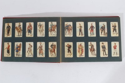 Lot 154 - Cigarette cards - Red, Wills Album, containing a set of 101 Wills 1895 Soldiers of the World.