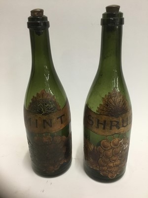 Lot 262 - Unusual pair of 19th century painted wine bottles, each with stopper