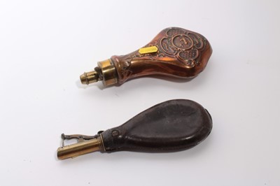 Lot 997 - 19th century copper powder flask with embossed hunting decoration together with a leather shot flask (2)