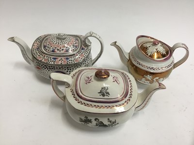 Lot 276 - Three 19th century pink lustre teapots and covers