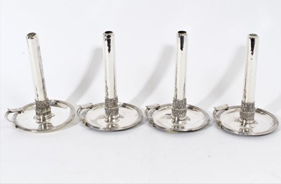 Lot 414 - Set of four 19th century silver plated chambersticks of circular form