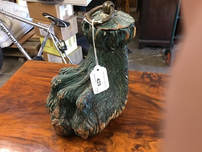 Lot 425 - Antique green painted and carved wooden door stop in the form of a lions paw