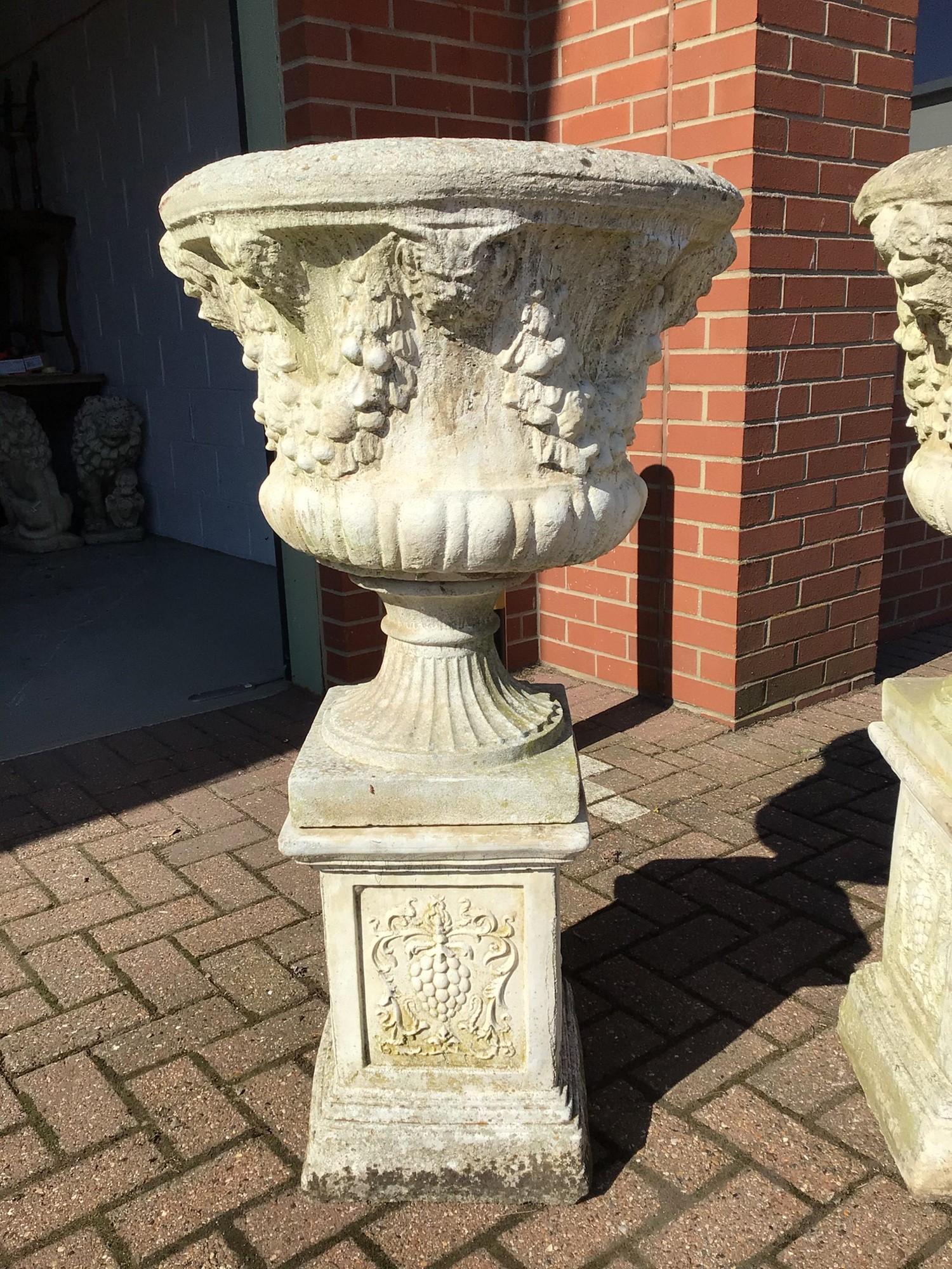 Lot 1 - Pair concrete garden urns on plinths H107, W57,