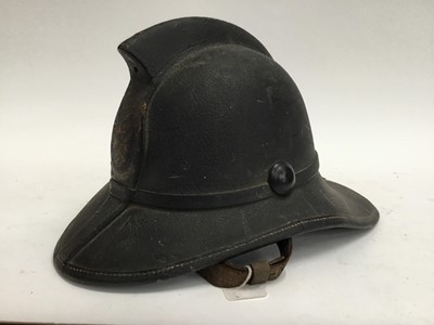 Lot 200 - Late 19th / Early 20th century leather fireman's helmet with painted crest , original liner and chinstrap, rear neck guard stamped Jas Mendry , Glasgow