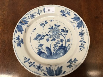 Lot 281 - 18th century Continental tin glazed blue and white plate with central foliate decoration and trailing floral borders, 27cm diameter