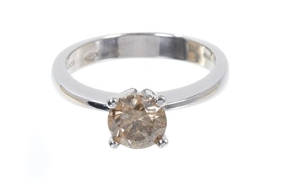 Lot 504 - Cinnamon diamond single stone ring with a round brilliant cut diamond estimated to weigh approximately 1ct in four claw 18ct white gold setting, Sheffield 2008.