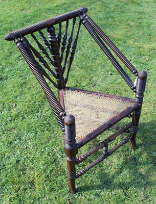 Lot 1757 - Very fine 19th century mahogany Turners' chair of typical form with triangular caned seat, on spindle supports