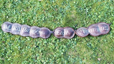 Lot 1762 - Highly unusual painted sailors' seed pod of large size, painted with the words Beira Portuguese, East Africa, 10.9.22, 92cm long overall