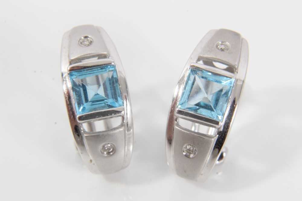 Lot 505 - Pair of contemporary diamond and blue topaz earrings in 9ct white gold setting with brushed and polished finish