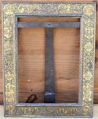 Lot 1776 - 19th century Islamic tooled brass picture frame rectangular form with busy engraved border of figural reserves and bird and scrolling arabesque, with easel support, 40cm x 31cm overall