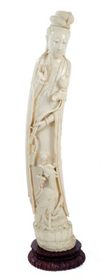 Lot 757 - Fine large 19th century Chinese carved ivory figure depicting Guan Yin with lotus flower, raised on hardwood stand