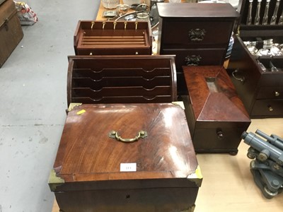 Lot 311 - Victorian flamed mahogany casket with brass mounted corners together with a mahogany tea caddy, letter rack, bank of three draws and other wooden draw set (5)