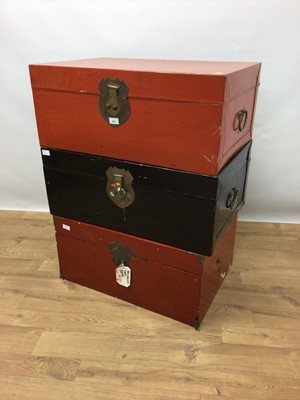 Lot 261 - Two red lacquer trunks and one black lacquer trunk (3)