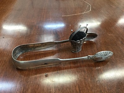 Lot 510 - Pair of silver sugar tongs together with a silver pin cushion in the form of a floral basket