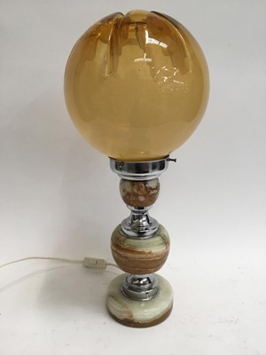 Lot 388 - Stylish lamp with onyx and chrome body with amber glass shade