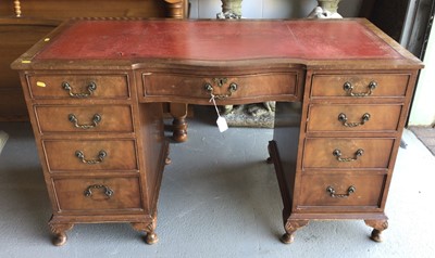 Lot 19 - Georgian style mahogany twin pedestal desk with tooled red leather top and nine drawers on cabriole feet