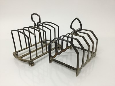 Lot 555 - Two early 20th century silver toast racks, one six division, the other four, all at 8ozs