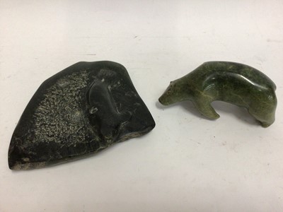 Lot 588 - Two carved green hardstone models, possibly Inuit, one of a polar bear and one of a seal on ice, both 17cm across