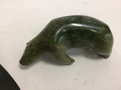 Lot 588 - Two carved green hardstone models, possibly Inuit, one of a polar bear and one of a seal on ice, both 17cm across