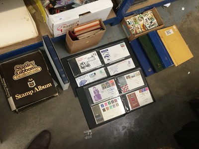 Lot 543 - Large collection of mixed ephemera to include First Day Covers, stamp albums, cigarette and tea cards, a Victorian bible and other items