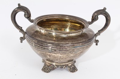 Lot 412 - Victorian silver sugar bowl of cauldron form with reeded decoration, twin scroll handles, raised on four scroll feet, (London 1841), maker Richard Pearce & George Burrows.