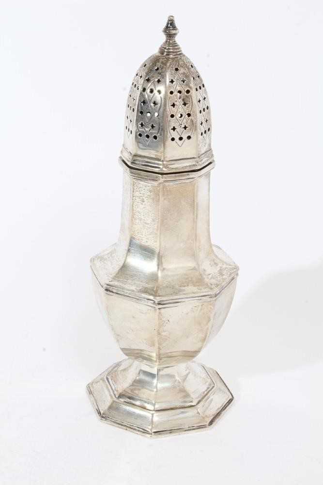 Lot 411 - George V silver sugar caster of faceted octagonal form with pierced slip in cover, on octagonal foot, (Sheffield 1936), maker Harrods Ltd,10oz, 22cm in height