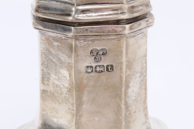 Lot 411 - George V silver sugar caster of faceted octagonal form with pierced slip in cover, on octagonal foot, (Sheffield 1936), maker Harrods Ltd,10oz, 22cm in height