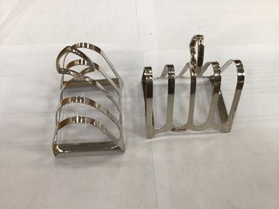 Lot 644 - Pair of silver toast racks together with another silver toast rack (3)